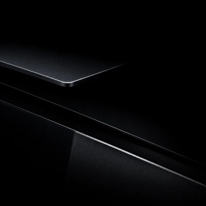 The edge of a dark slab catching a thin line of light