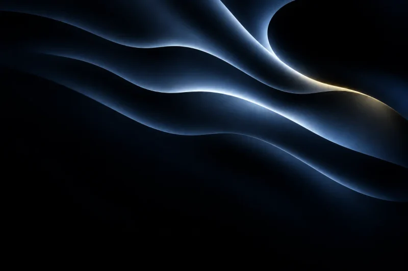 Layered black forms traced by silver and gold light.